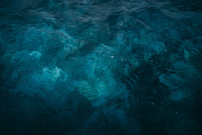 Deep blue ocean water with light patterns