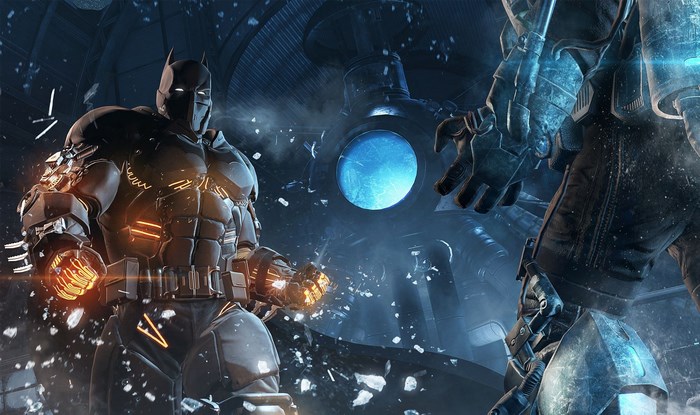 Batman and another armored figure in a destroyed room