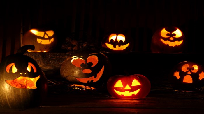 Carved Halloween pumpkins with glowing faces