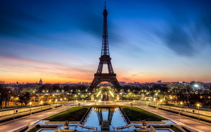 Eiffel Tower at sunrise with city skyline