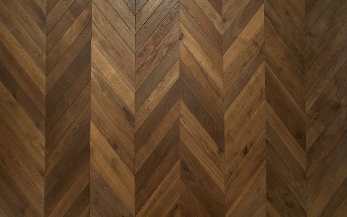 Dark brown wooden floor with chevron pattern