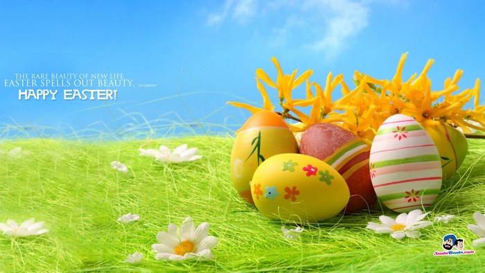 Happy Easter Decorated Eggs in Green Grass