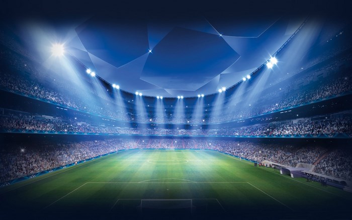 Football stadium with bright lights and spectators