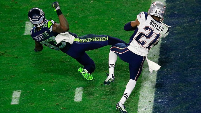 Seahawks player Lockette tackled by Patriots player Butler