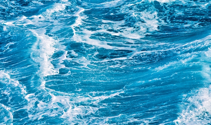 Ocean waves with white foam