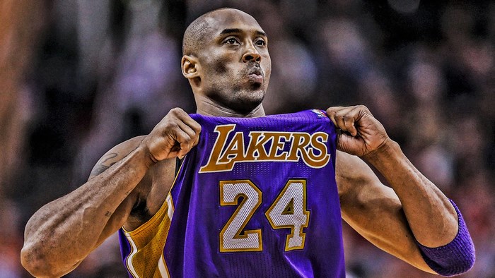 Kobe Bryant from Lakers holding jersey