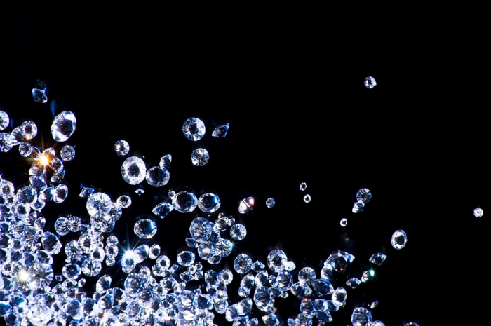 Scattered diamonds on a black background