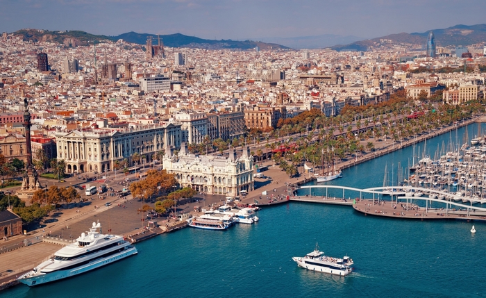 Barcelona waterfront with yachts and cityscape