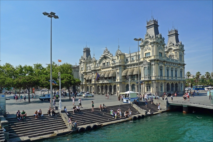 Barcelona waterfront building with people on steps