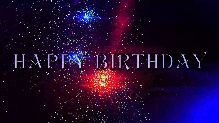 Happy Birthday text with colorful sparks