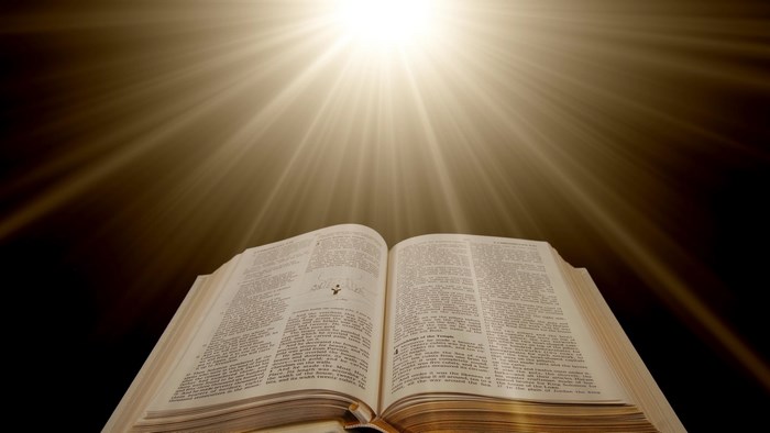 Open Bible with Light Rays