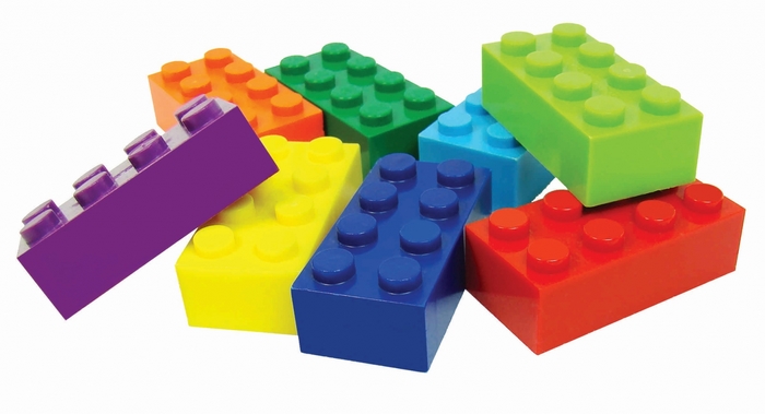 Colorful building blocks scattered on a white background