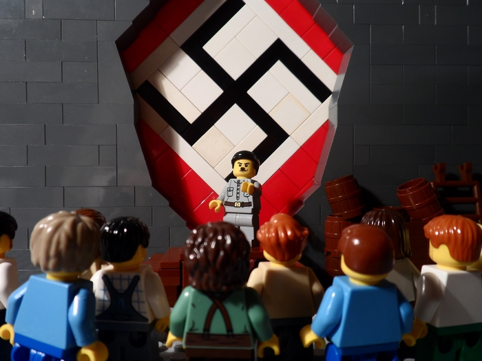 Lego Mini-Figure Speaking Near Swastika Symbol
