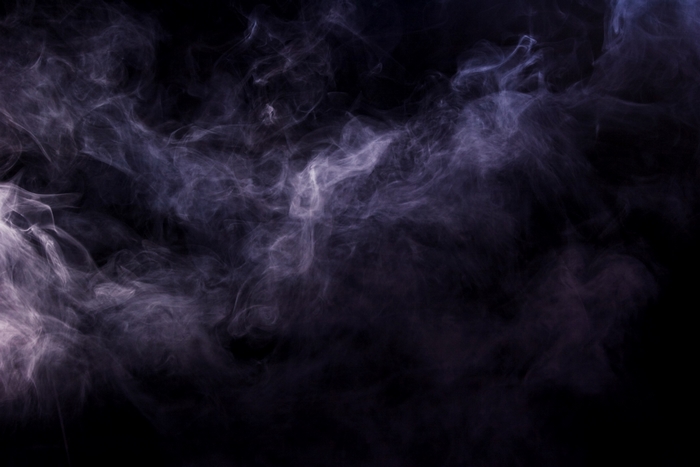 Purple smoke swirling against a black background