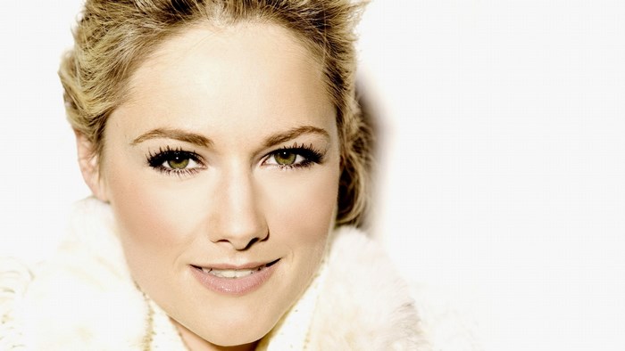 Woman with blonde hair and fur collar