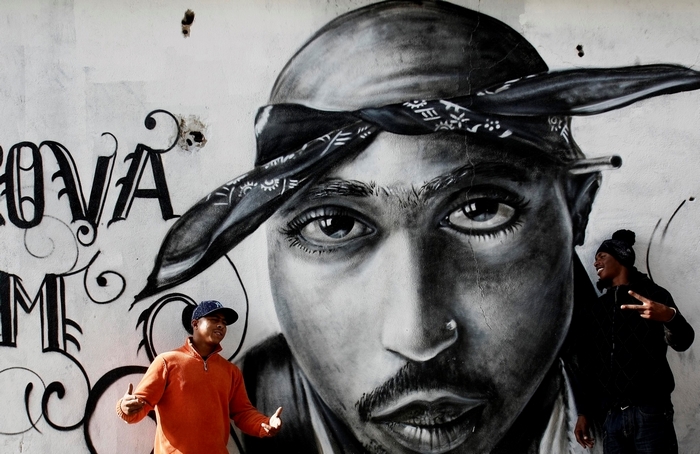 Tupac Shakur mural with two men