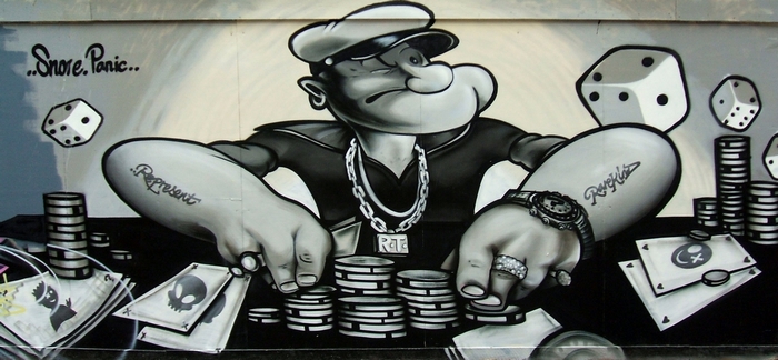 Popeye playing poker with dice and chips