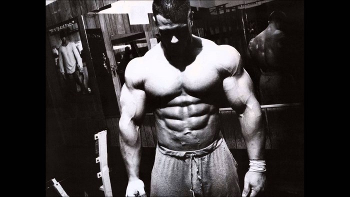 Bodybuilder posing in a gym