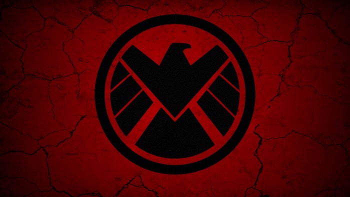 S.H.I.E.L.D. logo on cracked red background