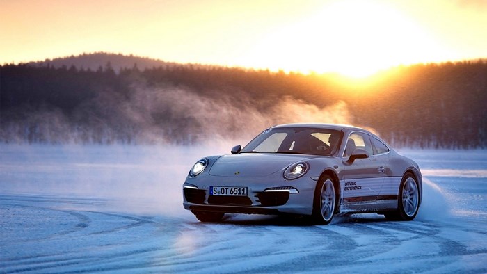 Porsche 911 Turbo driving on ice during sunset