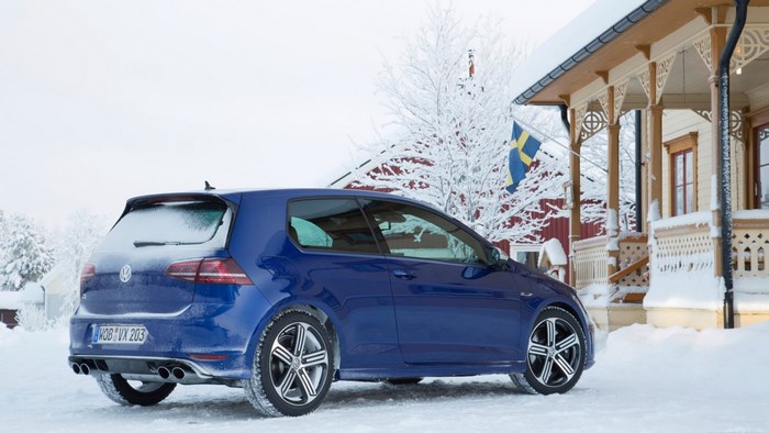 Blue Volkswagen Golf R in Snowy Swedish Landscape