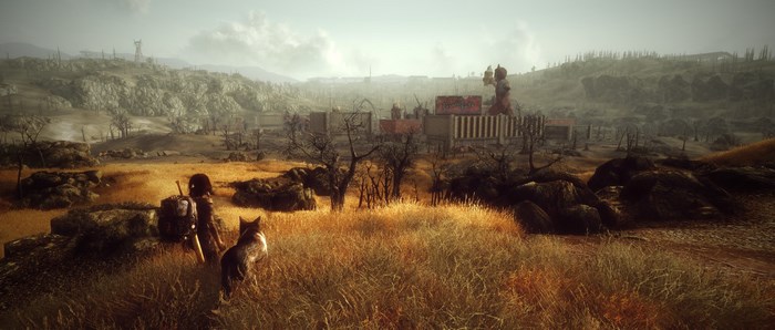 Fallout 3 character and dog overlooking a settlement