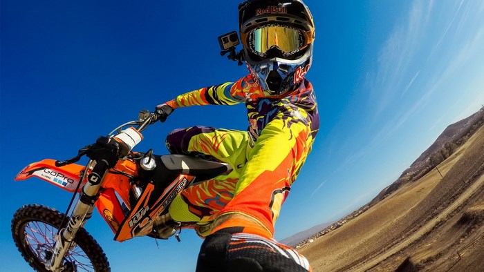 Motocross rider in mid-air with KTM bike