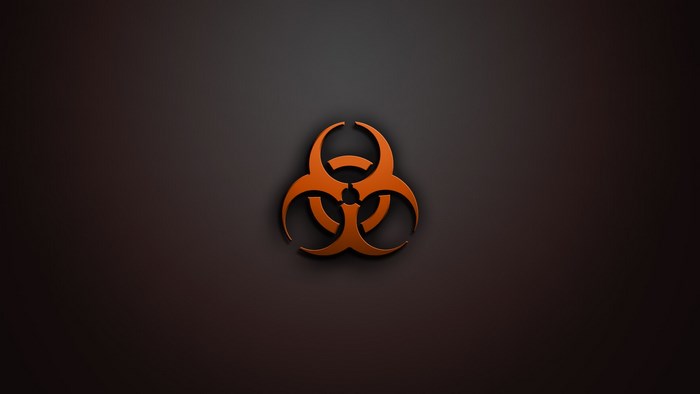 Biohazard symbol on dark background