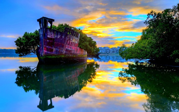 Abandoned Shipwreck at Sunset Reflection