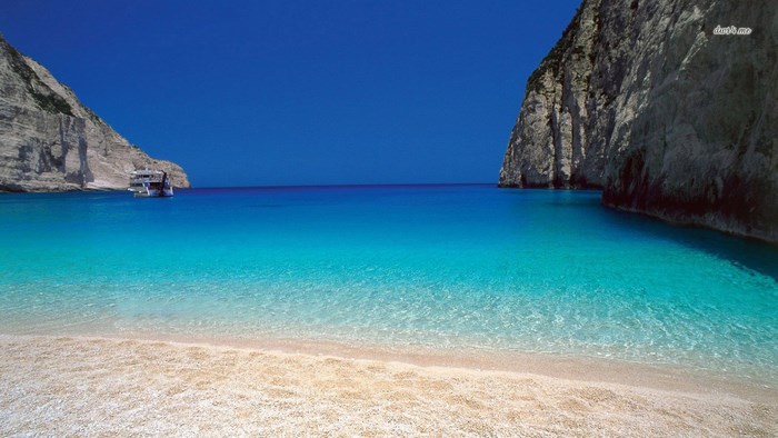 Beach with cliffs and boat