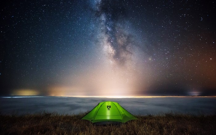 Glowing Tent Under the Starry Night Sky