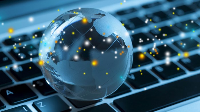 4K Globe on a Laptop Keyboard