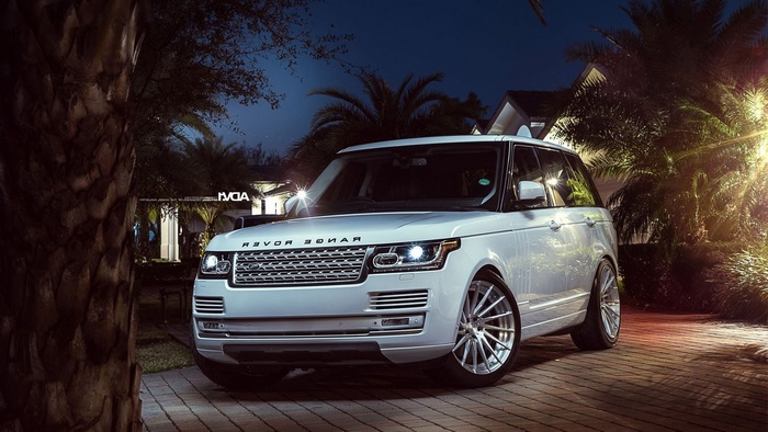 White Range Rover parked at night