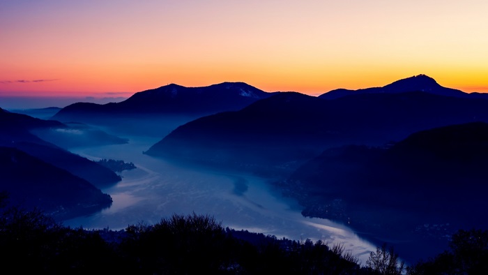 Mountain lake at sunset with colorful sky