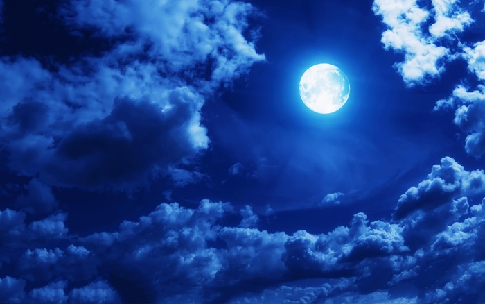 Full moon in a cloudy night sky 4K