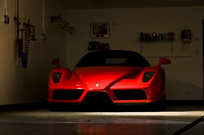 Red Ferrari Enzo in a garage