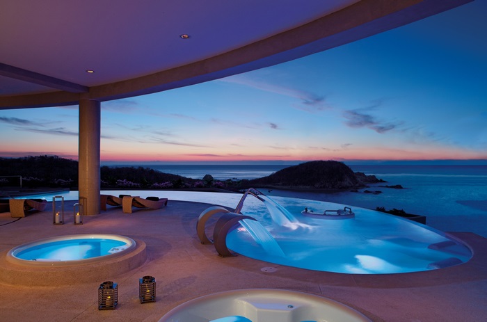 Resort and Spa with Infinity Pool at Sunset