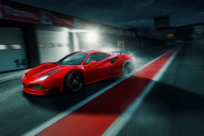 Red Ferrari 488 GTB racing on track