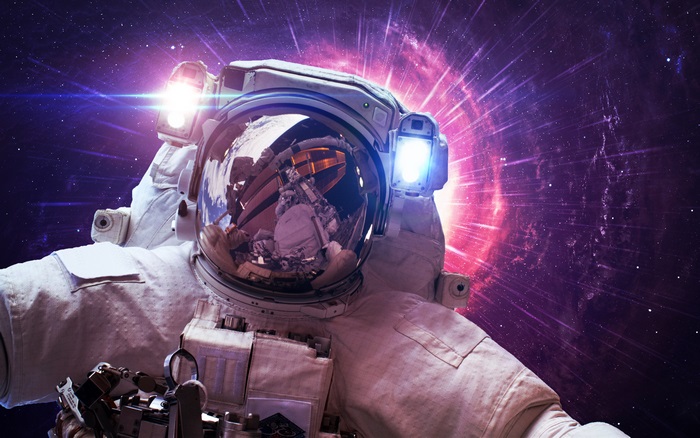 Astronaut in space with nebula
