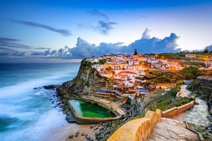Azenhas do Mar village cliffside view at dusk