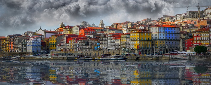 Porto cityscape with colorful buildings and river reflection