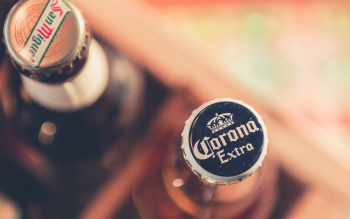 Corona Extra and San Miguel beer bottles