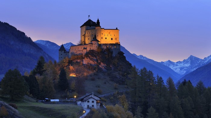 Sunset View of Castle on Hill in Switzerland