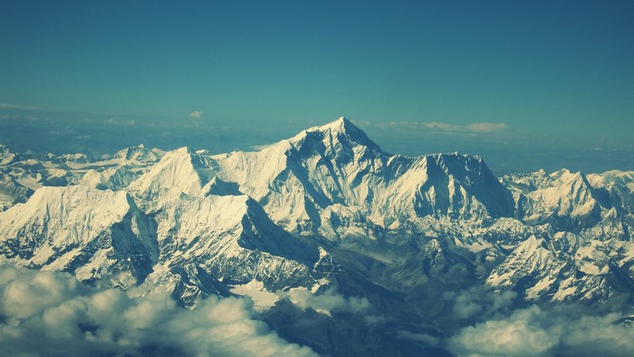 Snow-covered mountains under a clear blue sky