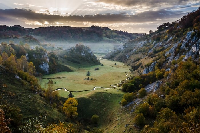Misty Sunrise Over Romanian Mountain Valley