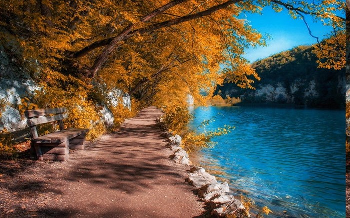 Autumn path by a blue lake in Plitvice National Park, Croatia