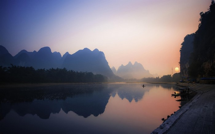 Misty River Landscape at Sunrise with Karst Mountains in China