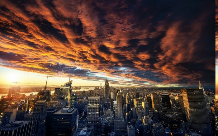 New York City Skyline at Sunset with Dramatic Clouds