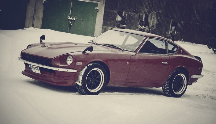 Red Datsun 240Z parked in snow