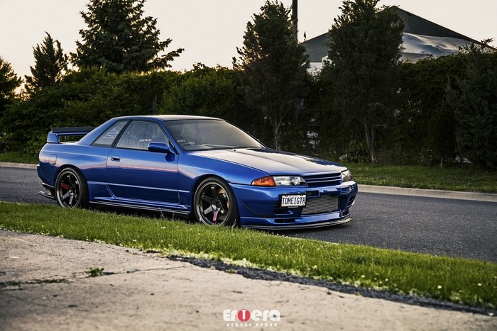 Blue Nissan Skyline R32 GTR parked on roadside